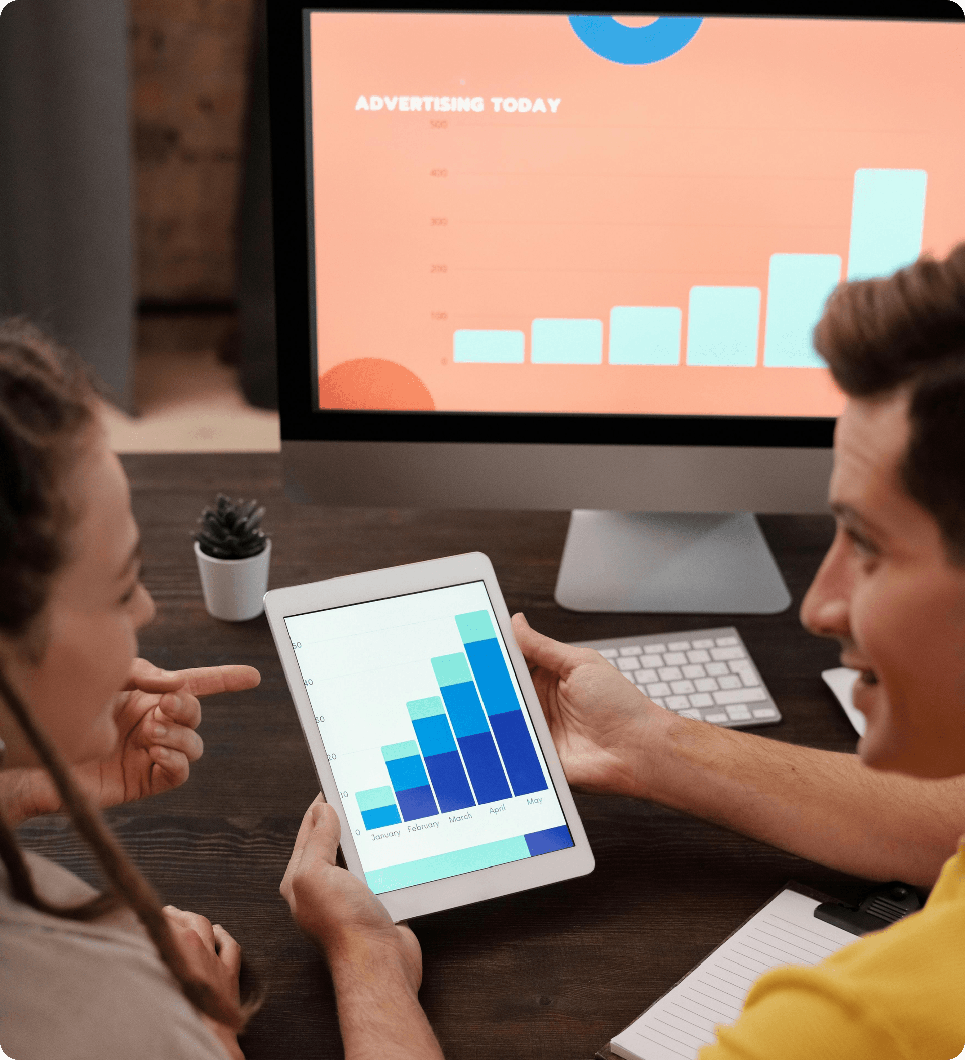 People looking at a graph on a tablet